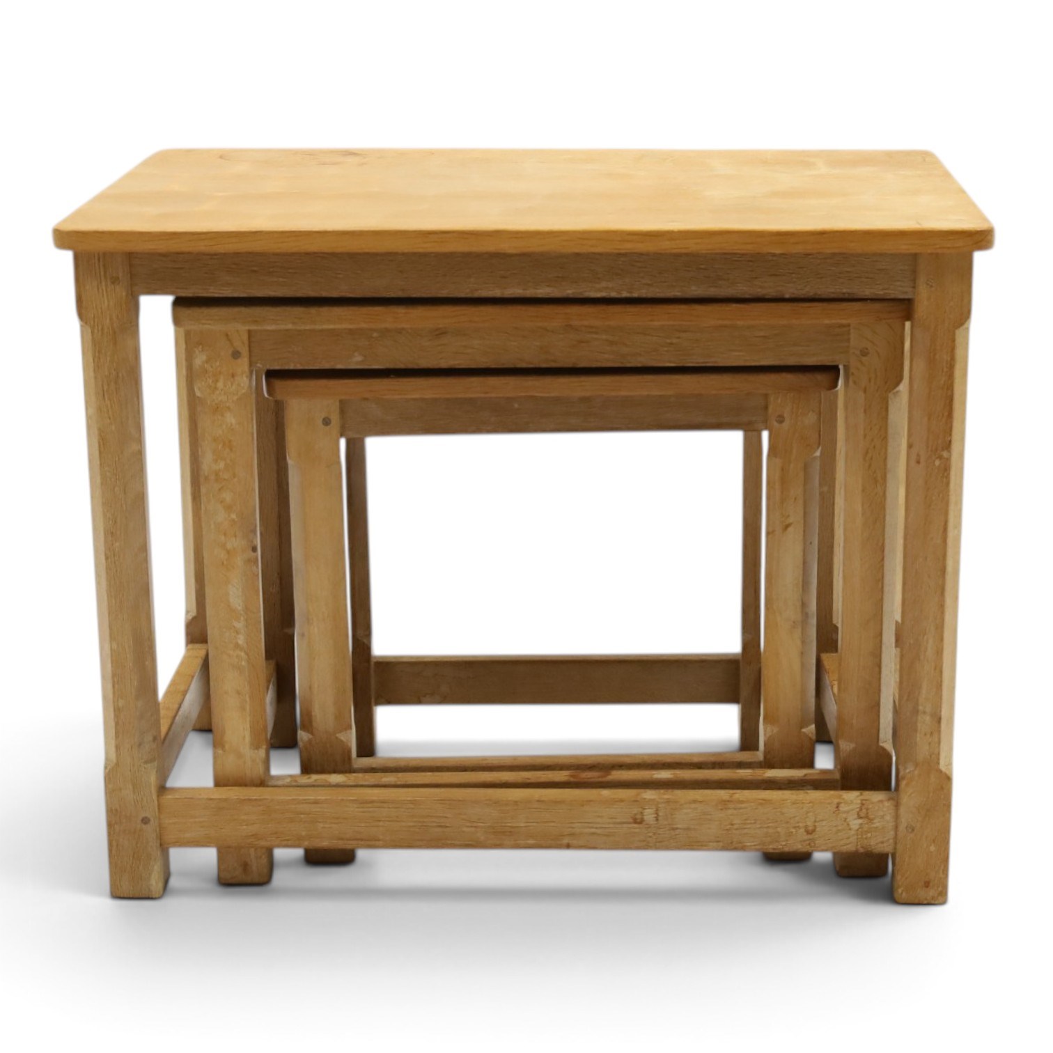 Mouseman - nest of three oak occasional tables, rectangular adzed top, on octagonal supports united by plain stretchers, each carved with mouse signature, by the workshop of Robert Thompson of Kilburn
