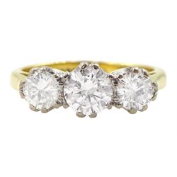 18ct gold three stone round brilliant cut diamond ring, stamped total diamond weight approx 0.95 carat 
