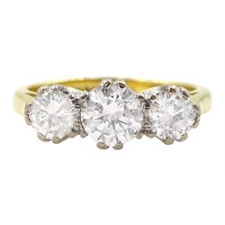 18ct gold three stone round brilliant cut diamond ring, stamped total diamond weight approx 0.95 carat 
