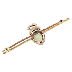 Edwardian gold and silver opal and diamond heart cluster brooch, central oval cut opal surrounded by rose cut diamonds, and surmounted by a diamond set ribbon bow