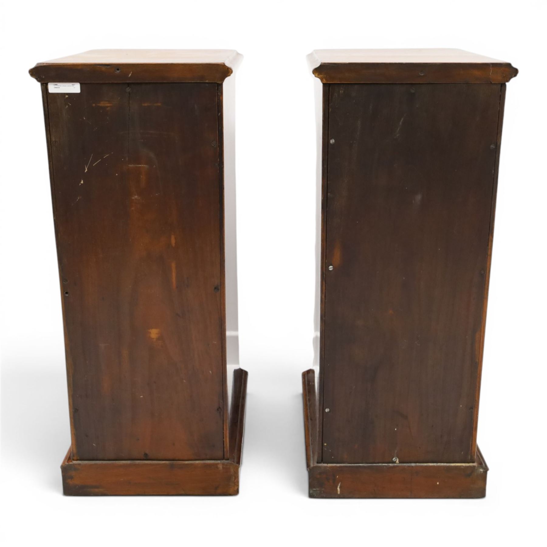 Pair of Edwardian mahogany pedestal chests, of moulded rectangular form, above four graduated drawers, brass swan neck handles, moulded plinth base