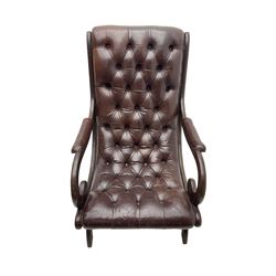 Regency style armchair, upholstered in buttoned leather with studded detail