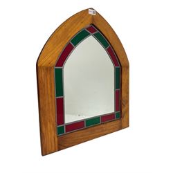 Beech framed arched wall mirror, green and red stained glass slip