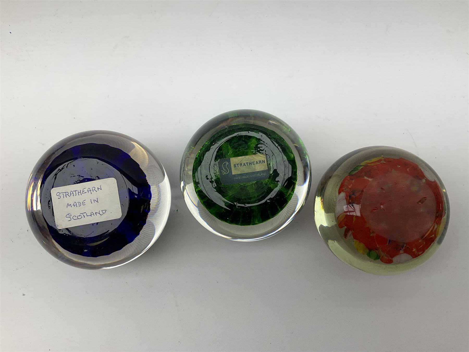 Five Millefiori glass paperweights, of differing designs, predominately by Strathearn