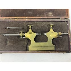 A 19th century brass French pivoting tool in its original box and a 20th century steel pivoting tool.