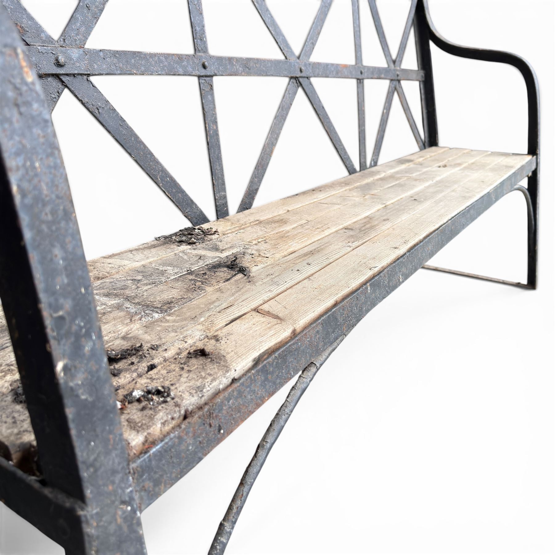 19th century and later Estate made wrought iron strapwork garden bench, the weathered wooden cresting rail over X-form strapwork back and slatted wooden seat