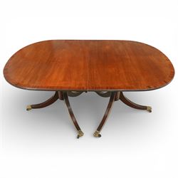 Arthur Brett & Sons - Regency design mahogany extending dining table and eight chairs, the oval top with rounded ends and two extension leaves, raised on twin pedestal supports with swept legs terminating in brass caps and castors, accompanied by a set of eight chairs comprising six single chairs and a pair of carvers, the chairs with curved backs and horizontal splat rails, upholstered seats, sabre legs and scrolling arms to the carvers
(Extends to 252cm)
(Chairs H 86cm, W 52cm)