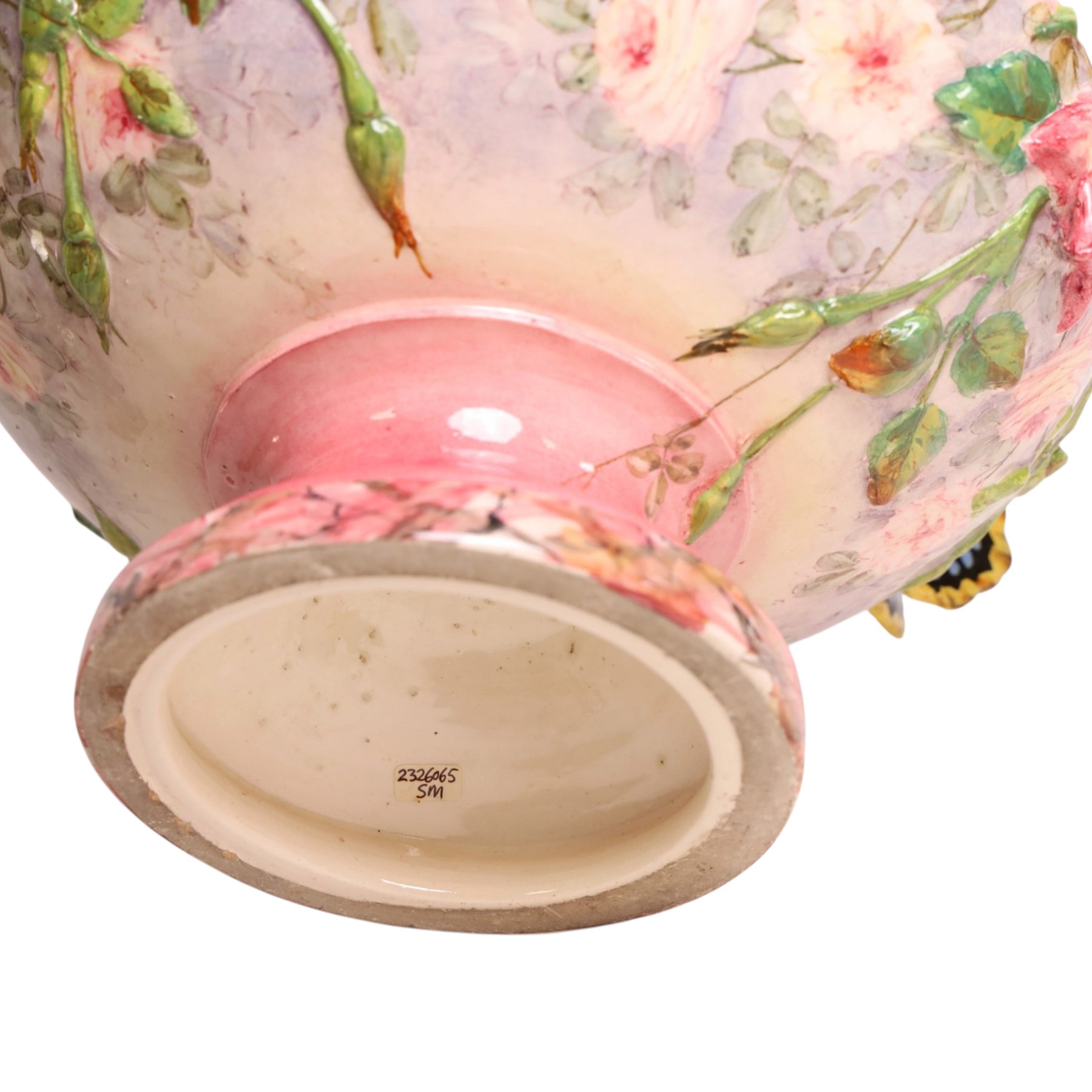 Delphin Messier (1836-1907), glazed earthenware cache-pot, decorated with three butterflies surrounded by floral and foliate motifs. upon a pink circular foot, signed beneath, H24cm