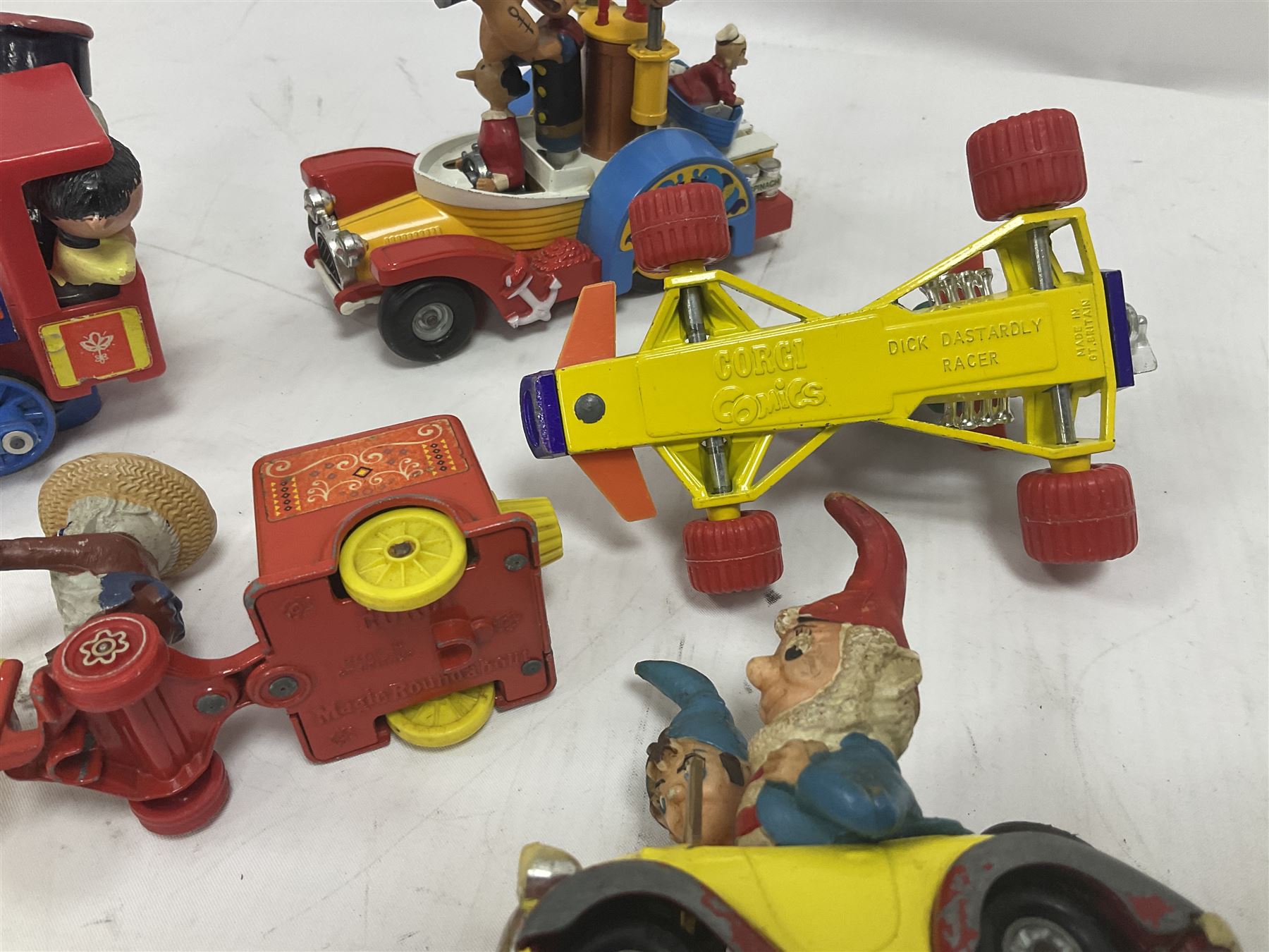 Corgi/Dinky - twelve unboxed and playworn TV/Film related die-cast models including Popeye Paddle Wagon; Dick Dastardly; Magic Roundabout; Muppets; Basil Brush; and Noddy (12)