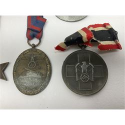 Five WW2 German medals/badges -German Defences West Wall Medal, War merit Cross, Red Cross Decoration, RAD tinnie brooch and Adolf Hitler 1934 medallion (5)