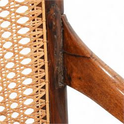 Victorian stained beech frame open armchair, arched cane work back and seat, on turned supports with splayed feet united by turned stretchers 