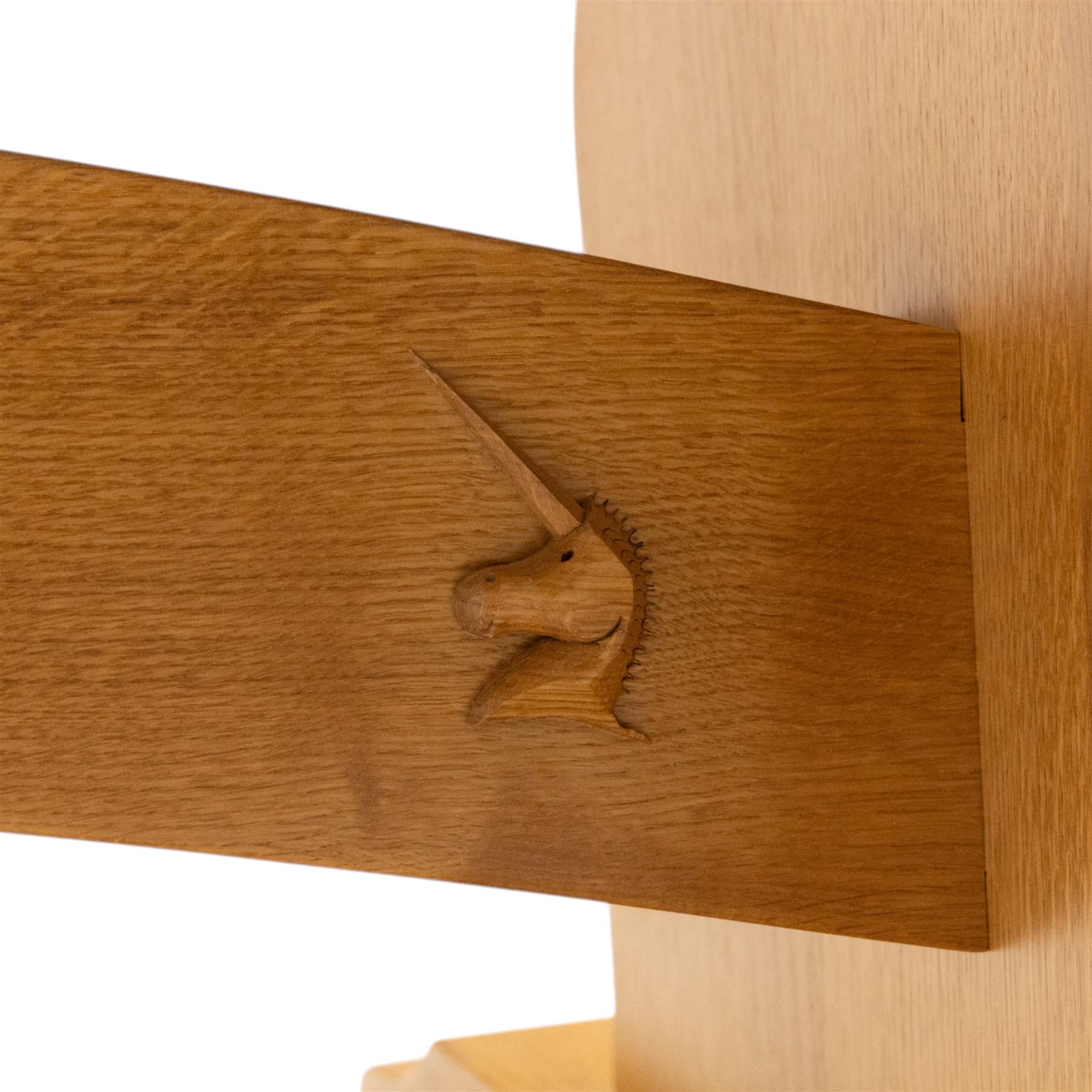 Unicornman - Yorkshire oak rectangular refectory style dining table by Coxwold cabinet maker Geoff Gell, rectangular top above trestle form base with broad scrolling outward outline, and heavy arched stretcher with Unicornman carved motif, traditional mortice and tenon pegged joints between the uprights