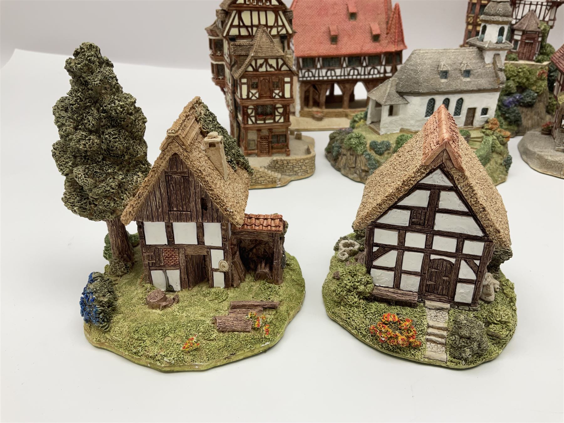 Sixteen Lilliput Lane models from the European collections, to include Dutch Collection; Aan de Amstel, Wipmolen, French Collection; Cabane De Guardian La, Porte Sachoenenberg La, German Collection Alte Schmiede, Das Rathaus, etc some with original boxes and deeds 