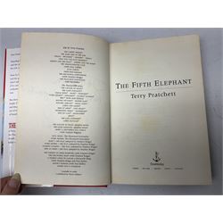 Collection of twenty-three hardback Terry Pratchett books, comprising approximately eighteen first editions including The Fifth Elephant signed & inscribed by Pratchett, all with dustjackets