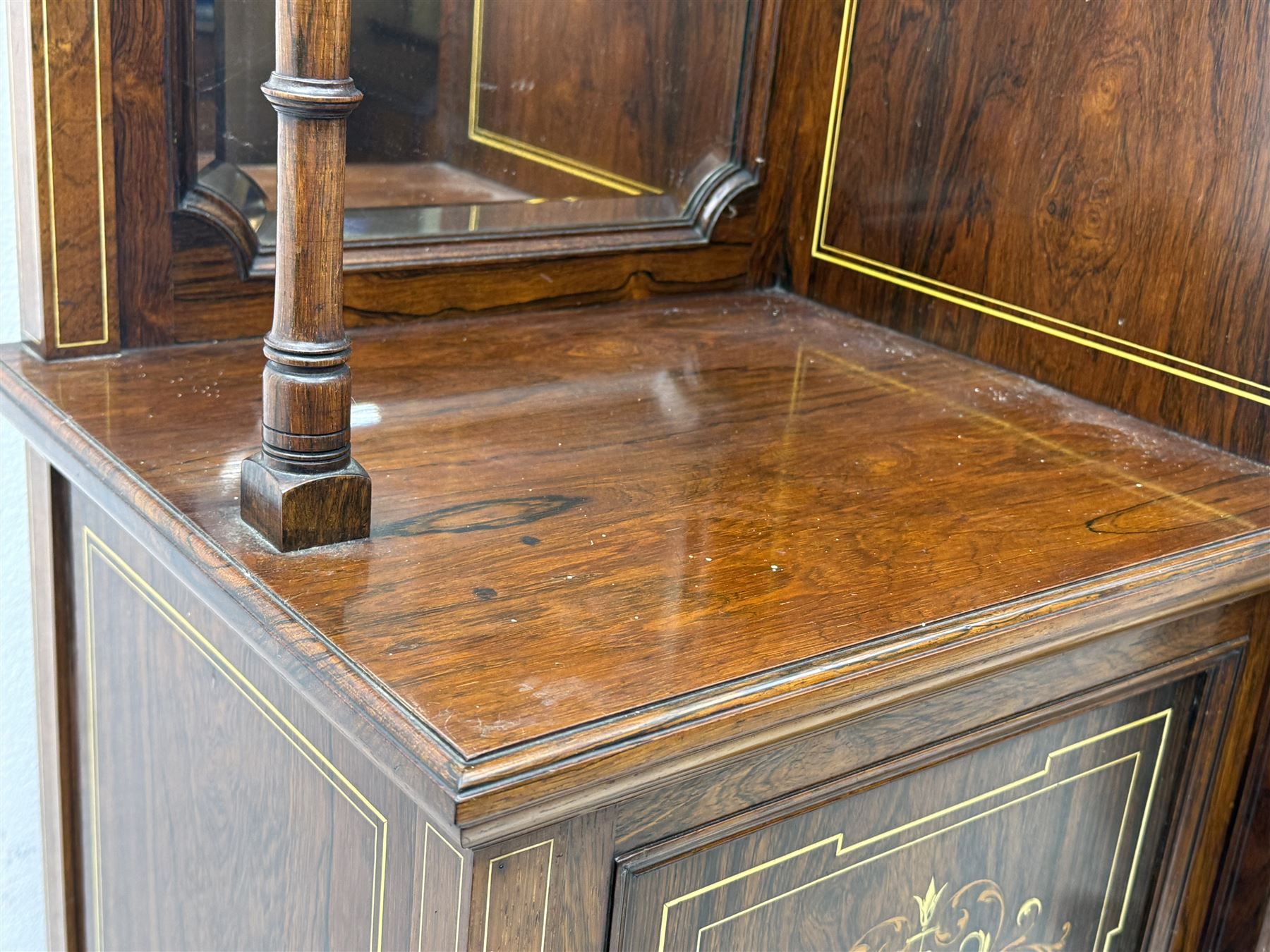 Victorian hardwood and inlaid display cabinet, central breakfront glazed display with astragal glazing and mirror back, flanked by mirrored alcoves with turned supports, below foliate and scrolling marquetry panels enclosing cupboard doors, shaped open shelves with turned supports beneath, on tapered and spade feet