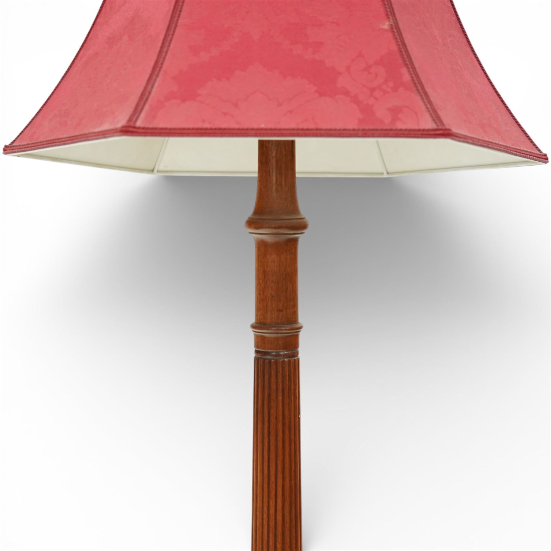 Hepplewhite design mahogany standard lamp, fluted column support with ring turned details, raised on a stepped square base with out-swept feet, fitted with a shaped red fabric lampshade
