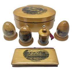 Six sewing related Mauchline ware comprising an oval reel box with internal label for Clark & Co's, tape measure, pin case and three thimble holders of ovoid form 