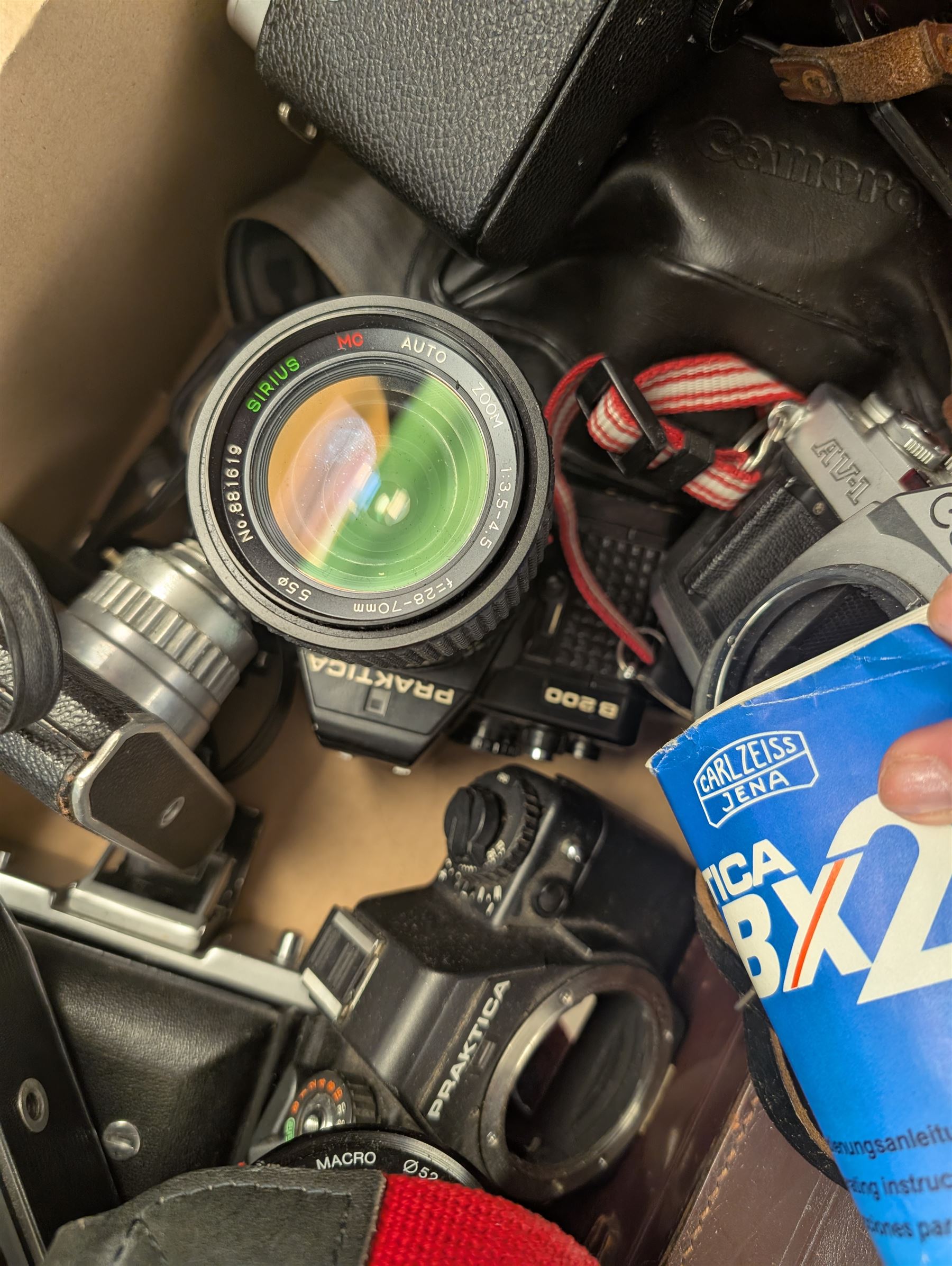 Collection of cameras, including Canon EOS 650, Praktica BMS, Inovar, Praktica MTL3, Zeiss Ikon Contina, etc