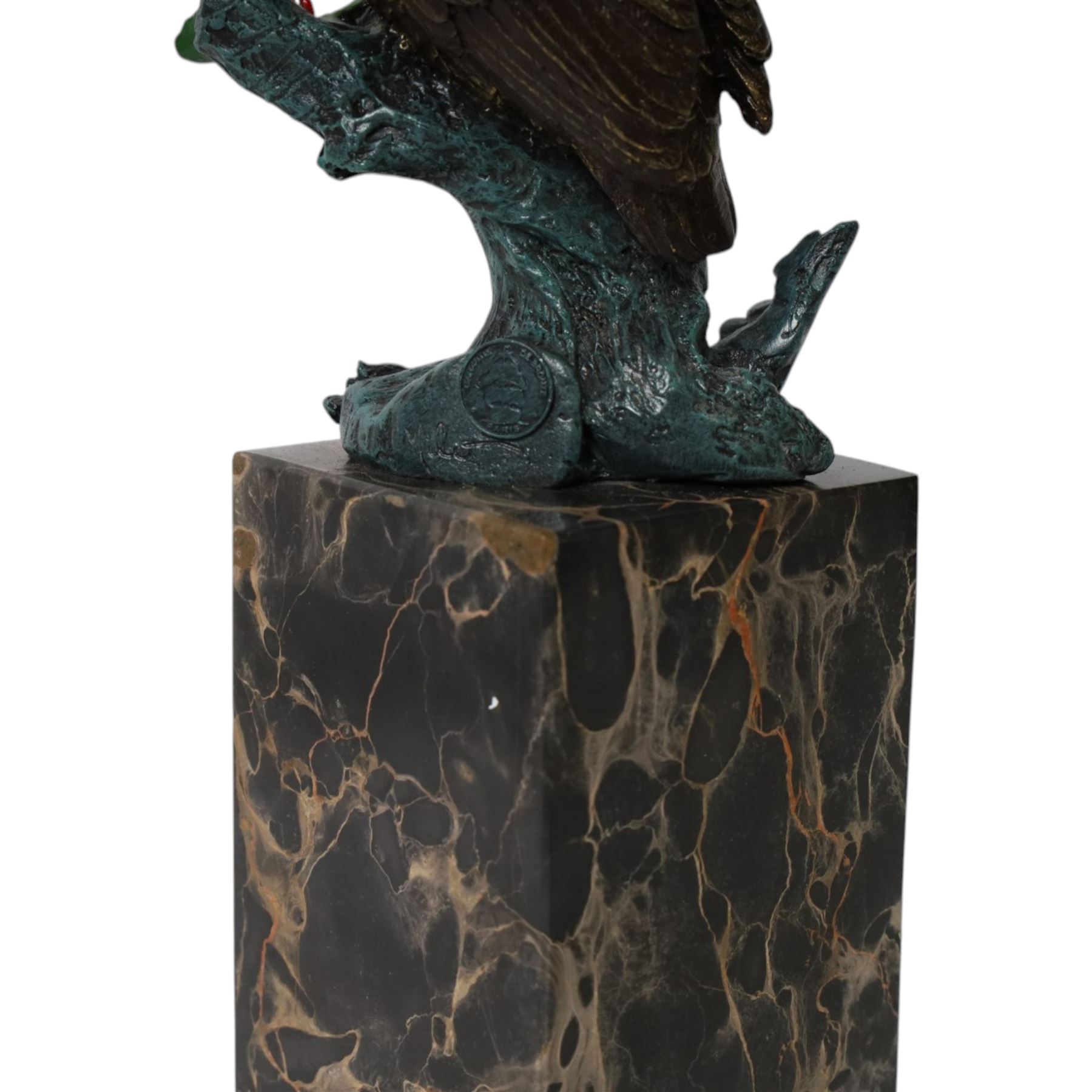 Cold painted bronze figure, modelled as an owl perched upon a tree stump signed Milo and with foundry mark, raised upon black veined marble plinth, H27.5cm