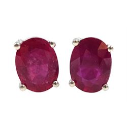Pair of silver oval ruby stud earrings, stamped 925