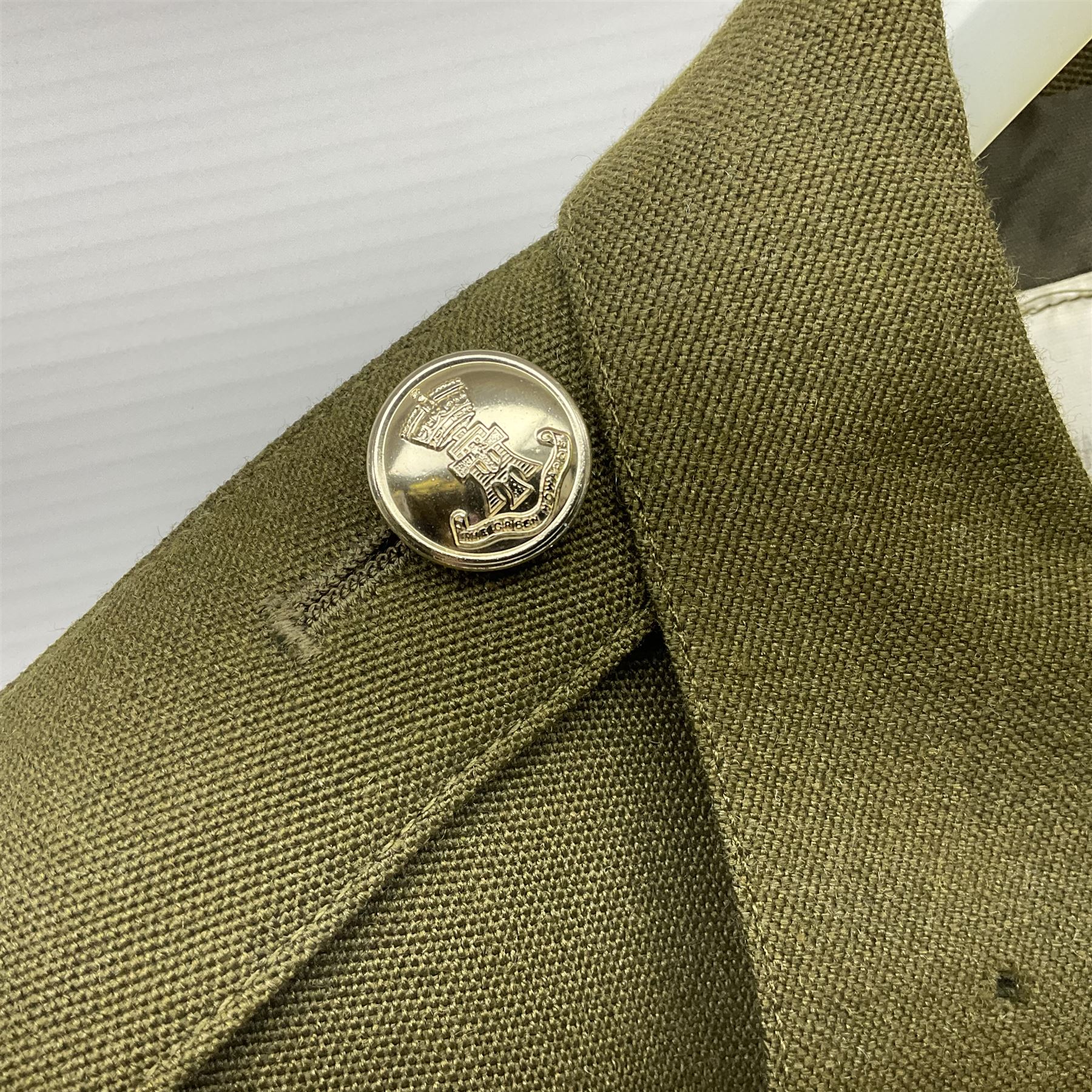 Two post-WWII British Army No.2 Dress tunics, one with Green Howards buttons; army shirt dated 1951; Royal Fleet Auxilliary jacket with trousers; three RAF/WAAF uniforms and RAF Greatcoat; and three canvas/webbing bags, two dated 1943 & 1945