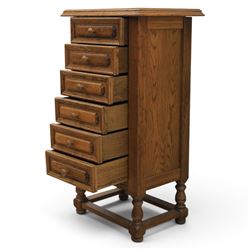 Early 20th century oak pedestal chest, with six drawers with moulded edges, raised on turned supports united by a stretcher 