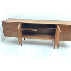Mid 20th century A.H.McIntosh teak sideboard, central two cupboard door opening, flanked by three graduating drawers and fall front opening, all enclosing fitted interior, stile supports 