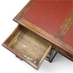 Late 19th century twin-pedestal desk, red leather inset top over an assortment of eleven drawers, on plinth base (W126cm D65cm H77cm); with Edwardian oak framed Captains swivel desk chair, of tub shaped form with spindle back supports (W60cm H89cm)