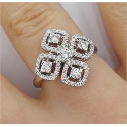 18ct white gold diamond dress ring, four round brilliant cut diamond with halo surround of diamonds and a central round brilliant cut diamond