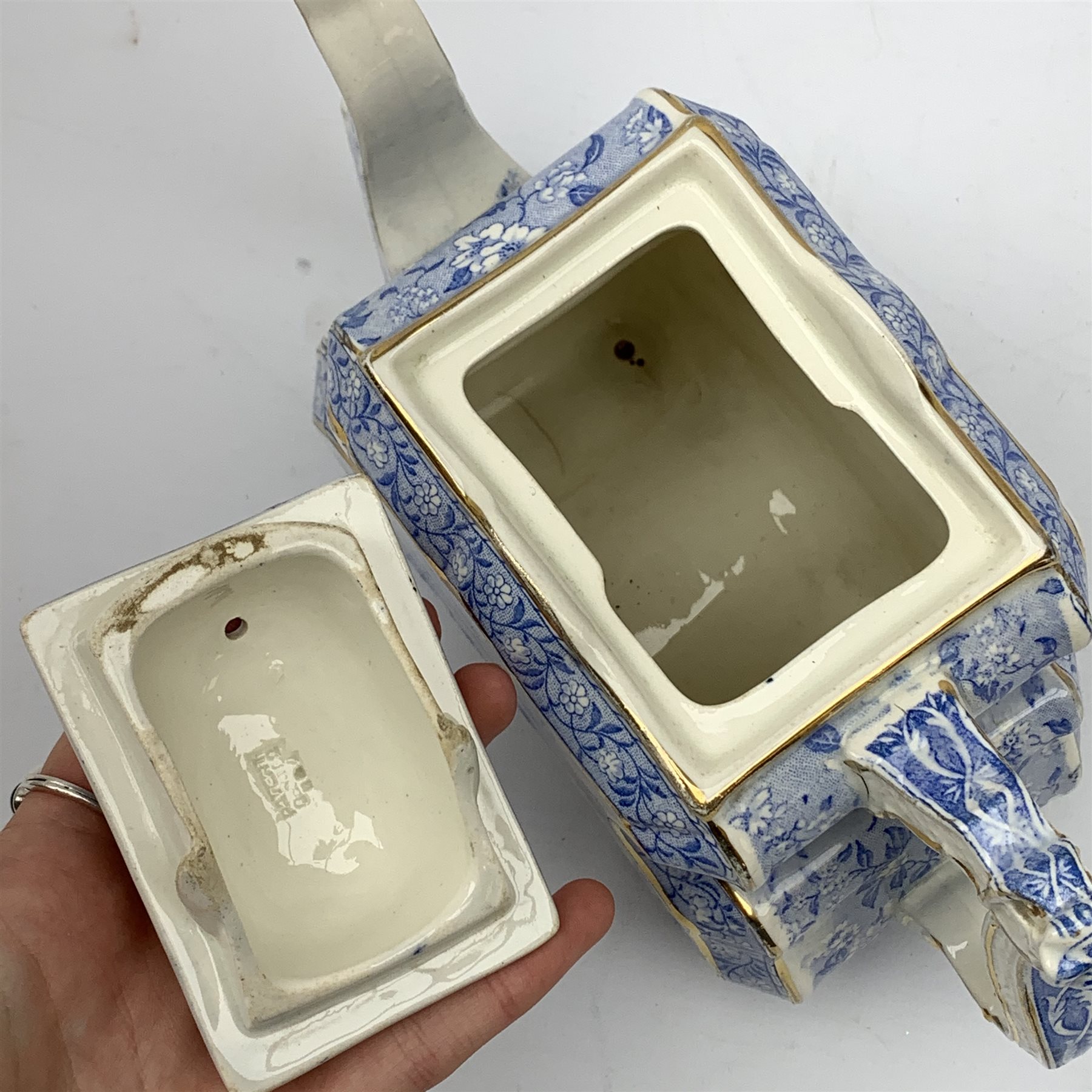 A Victorian Burgess and Leigh Aesthetic style blue and white teapot, decorated with an Indian hunting scene and heightened with gilt to edges, H17cm. 
