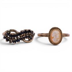 Four 9ct gold rings, including cameo and three stone set examples