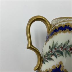 Sèvres soft paste porcelain coffee can and saucer with date code for 1767, painted with floral and laurel leaf garlands within blue scalloped and gilt borders, interlaced LL monogram enclosing the date letter O above painters mark for Catrice, coffee can H7.5cm, saucer D15cm
