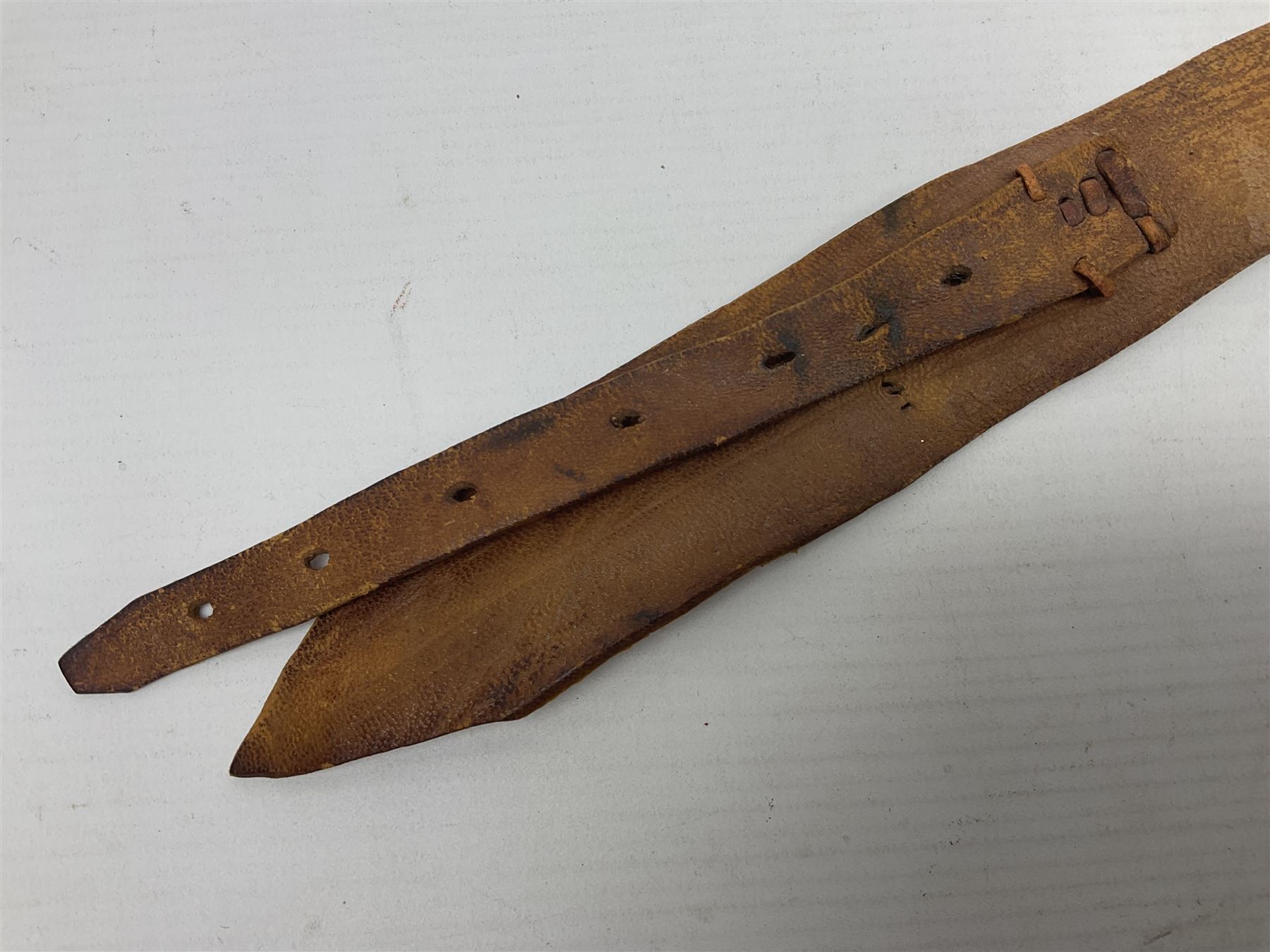 Saudi Arabian khanjar dagger with 29.5cm curving double edged  steel blade; white metal and copper mounted horn grip; in white metal mounted brass and leather scabbard incorporating embroidered leather wearing strap