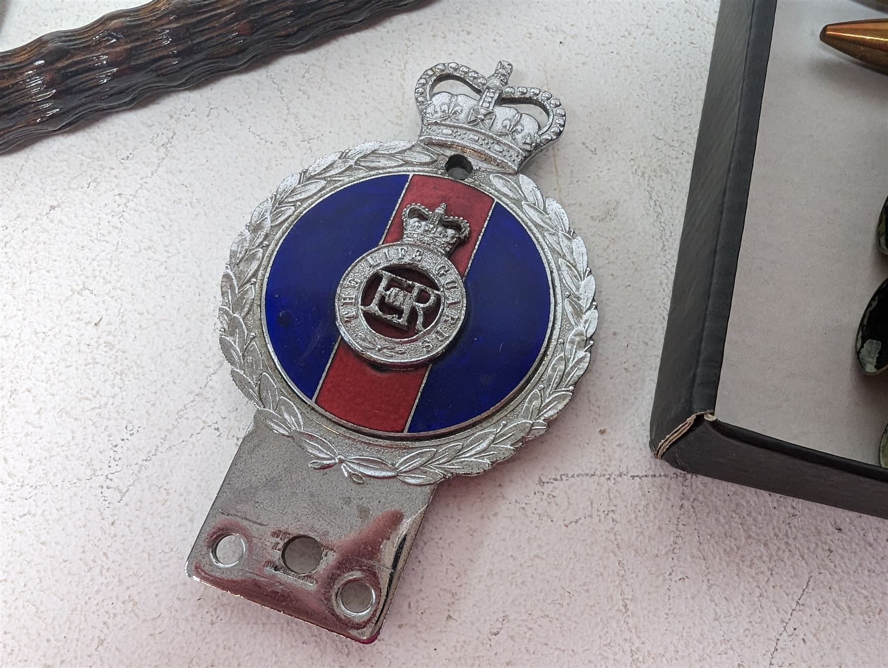 Walking stick with carved monkey handle, glass shooting flask in the form of a cartridge, bullet casings and other collectables