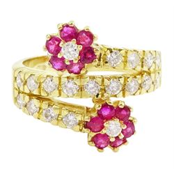 18ct gold ruby and diamond flower head crossover ring, two flowers each set with a single ...