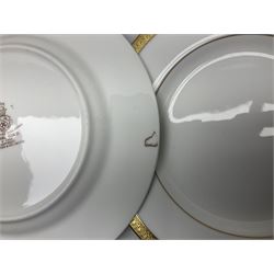 Royal Doulton Royal Gold pattern tea and dinner service for eight, comprising dinner plates, side plates, tea plates, soup bowls, sauce boat and saucer, dessert bowls, coffee cans and saucers, teacups and saucers and two lidded tureens