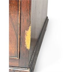 Georgian design mahogany kneehole desk, moulded rectangular top with red gilt-tooled leather writing surface, over an arrangement of nine cock-beaded drawers with brass swan neck handles, on bracket feet