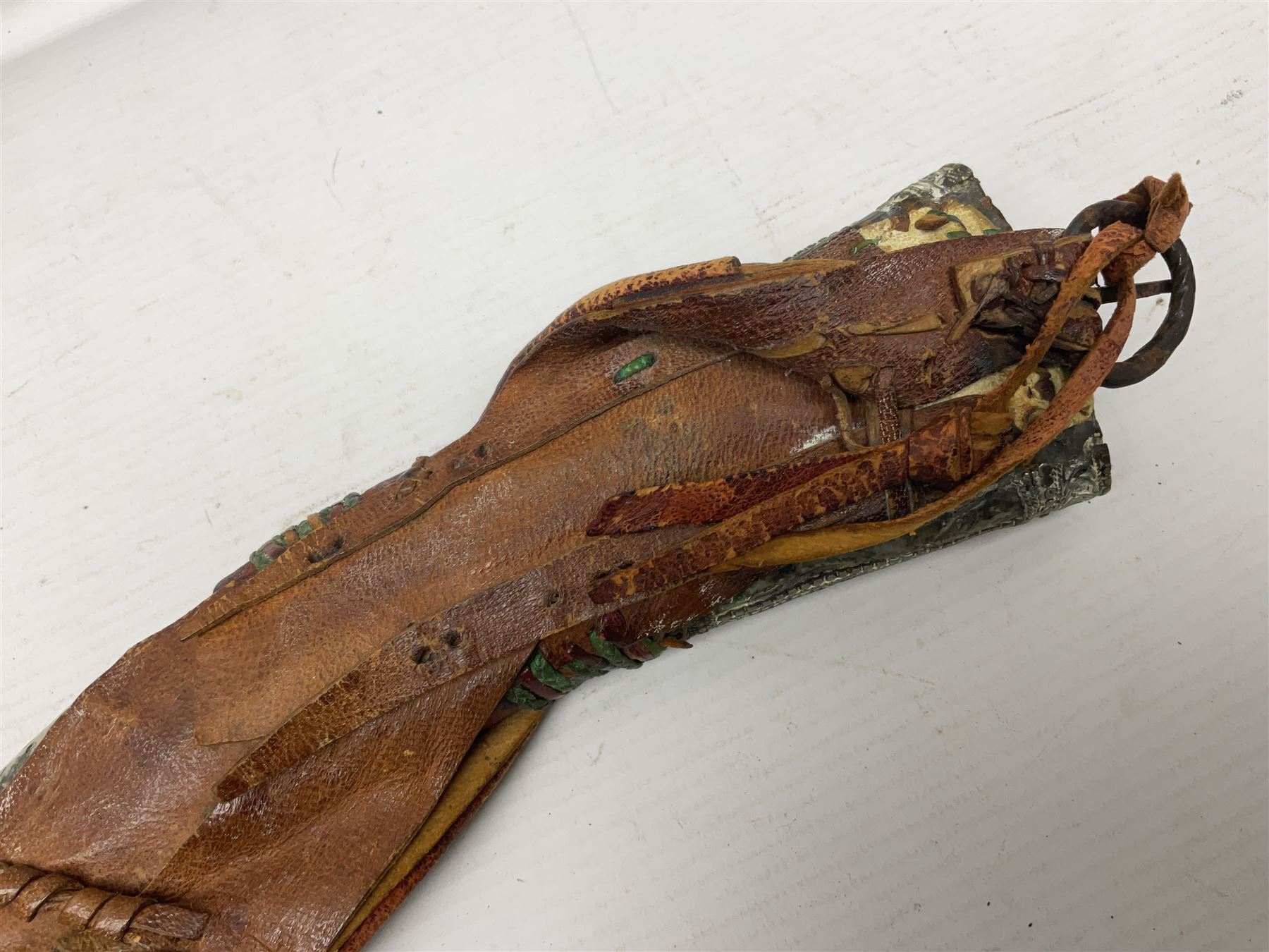 Saudi Arabian khanjar dagger with 29.5cm curving double edged  steel blade; white metal and copper mounted horn grip; in white metal mounted brass and leather scabbard incorporating embroidered leather wearing strap