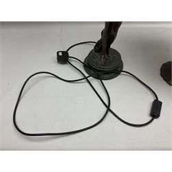 Tiffany style lamp in the form of a semi nude woman holding up a leaded lampshade together with a similar table lamp