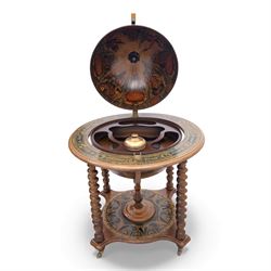 20th century Italian reproduction globe drinks table, the cartographic sphere decorated with Renaissance-style map scenes, hinged upper section enclosing bottle storage, with printed zodiac and calendar ring to the top, on spiral-turned legs joined by a compass rose undertier, brass castors below