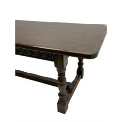 Large oak refectory dining table, rectangular top over guilloche carved frieze rails, turned supports joined stretchers