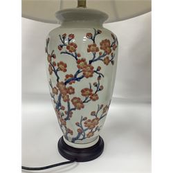 Pair of large table lamps of ovoid form, decorated with a peach blossom on a white ground, raised upon a circular base, including shade H70cm