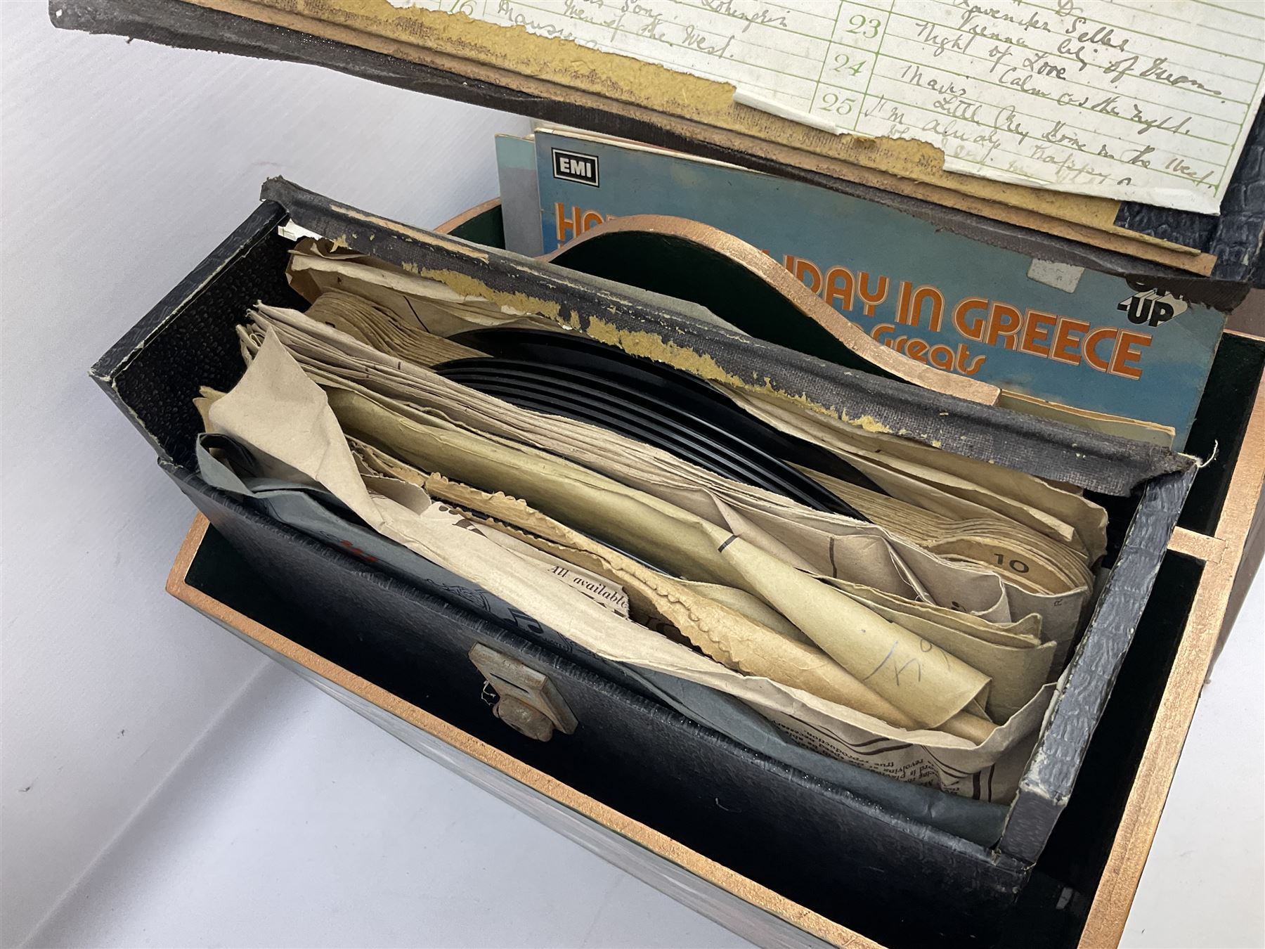 Wooden magazine rack, with floral detail, together with a collection of records, to include the box sets 'the Story of Great Music', 'Popmobility', Happy Holiday in Greece  etc, in three boxes 