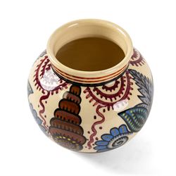 Paul Fouillen for Quimper pottery, decorated with stylised flowers, in blue and purple tones in cream tones, H14cm