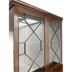Acorn Industries - Georgian design mahogany bookcase on cupboard, fitted with two astragal glazed doors enclosing three glass shelves, base with two cock-beaded drawers over two panelled cupboards, inlaid with acorn signature, by Alan Grainger, Brandsby