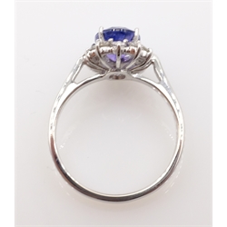  White gold oval purple sapphire and round brilliant cut diamond cluster ring hallmarked 18ct sapphire = 2.1 carat, diamond = approx 0.36 carat  