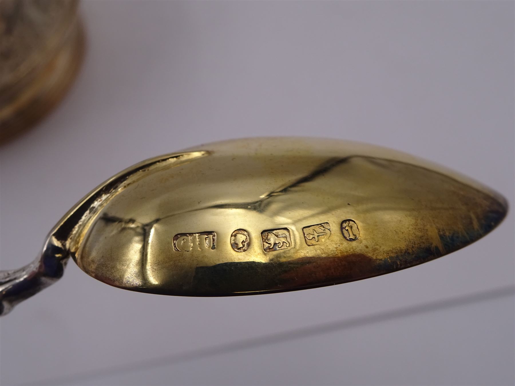 Victorian silver bowl, with embossed floral decoration and beaded rim, gilt interior and two applied shield cartouches, upon stepped circular foot, with a silver apostle spoon, with gilt bowl, both hallmarked George Unite, Birmingham 1883, bowl H5.5cm, within fitted tooled leather, silk lined case