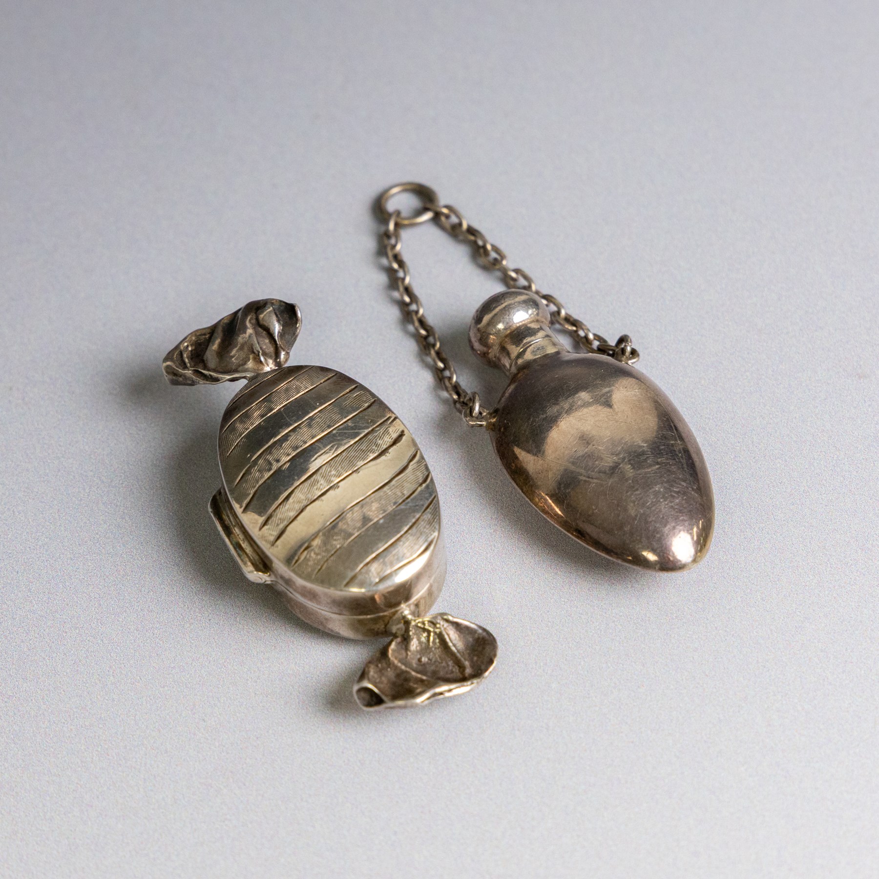 Silver trinket box, in the form of a wrapped sweet, stamped 925, together with a silver chatelaine scent bottle, hallmarked