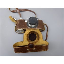  Leica 35mm film camera, Ernst Leitz Wetzlar D.R.P. No.371257, with Ernst Leitz Wetzlar Summitar f=5cm 1:2 No.579109 lens cover, in leather Leica case  