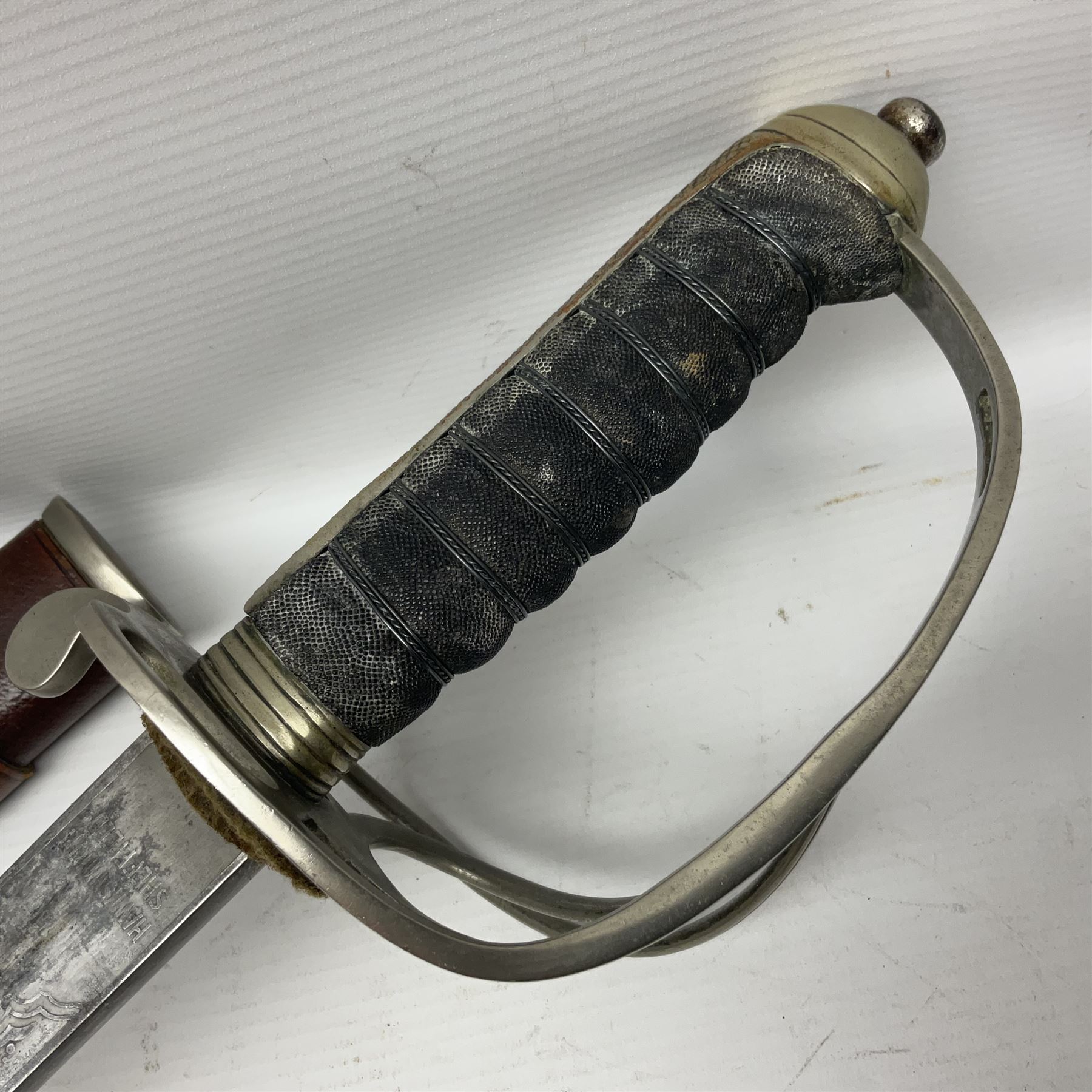 WWI 1821 pattern Royal Artillery officer's sword, the 82.5cm decorative blade by Hawksworth Sheffield etched with GVR cypher and crown, 'Royal Artillery' and field gun between scrolling foliate panels; three-bar hilt with wire-bound fish skin grip and chequered backstrap; in leather covered scabbard L99cm overall